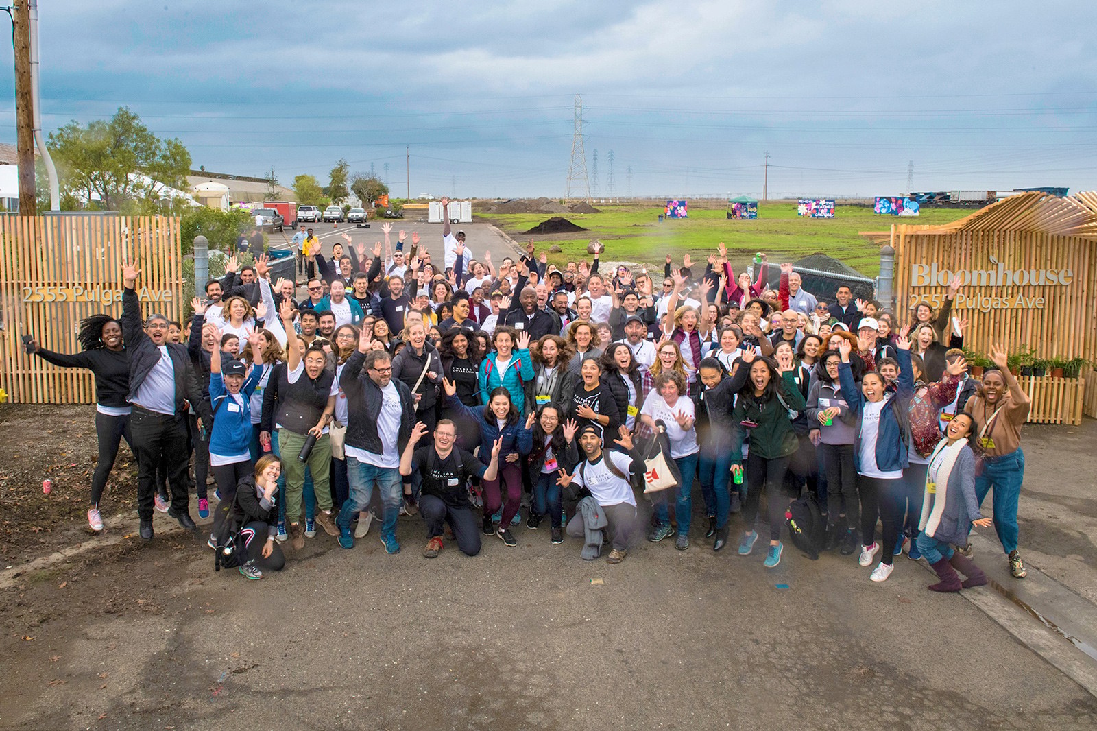 A large team of people gathered to celebrate the opening of a new community center